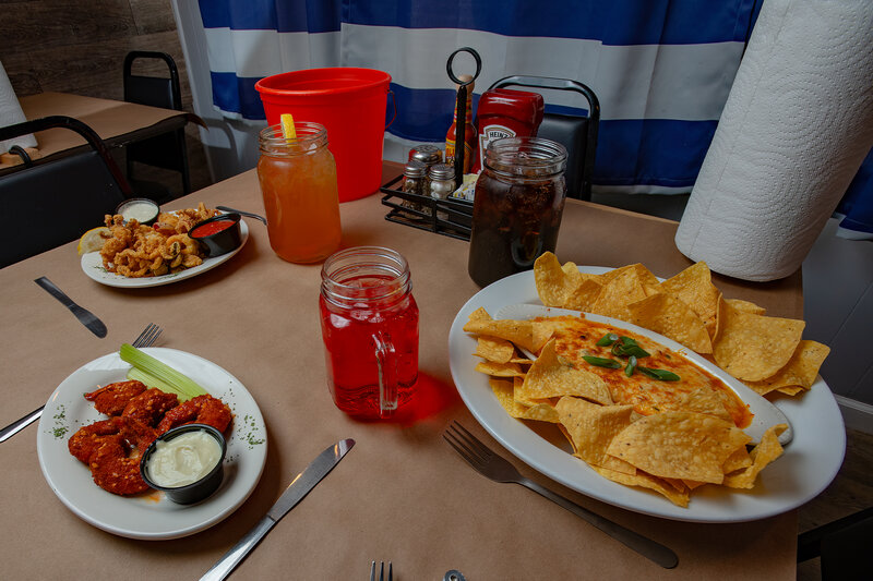 Table with multiple appetizers and drinks